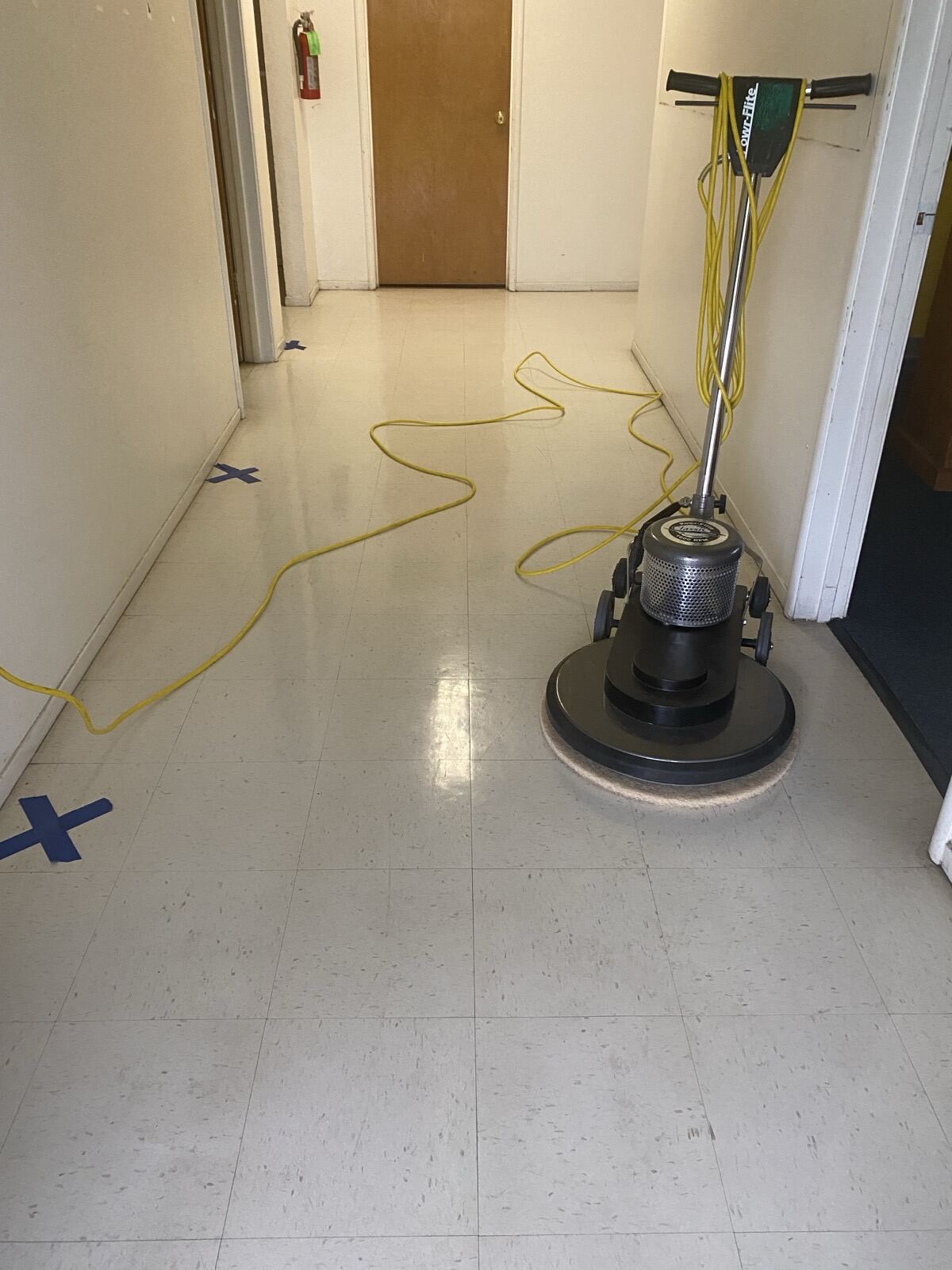 Powr-Flite buffer on hallway VCT showing dull vs polished contrast